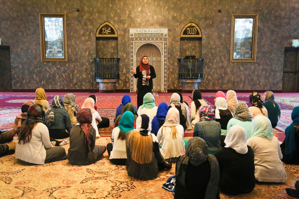 Umama Alam talks to students from Mother of Mercy High School inside the mosque of the Islamic Center of Greater Cincinnati during a tour of the campus Wednesday, Nov. 4, 2015.