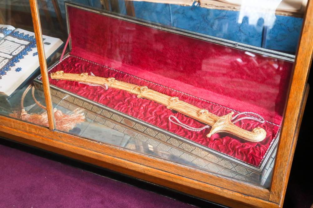 A sword gifted by the late King Hussein of Jordan sits inside a glass case at the Islamic Center of Greater Cincinnati. 