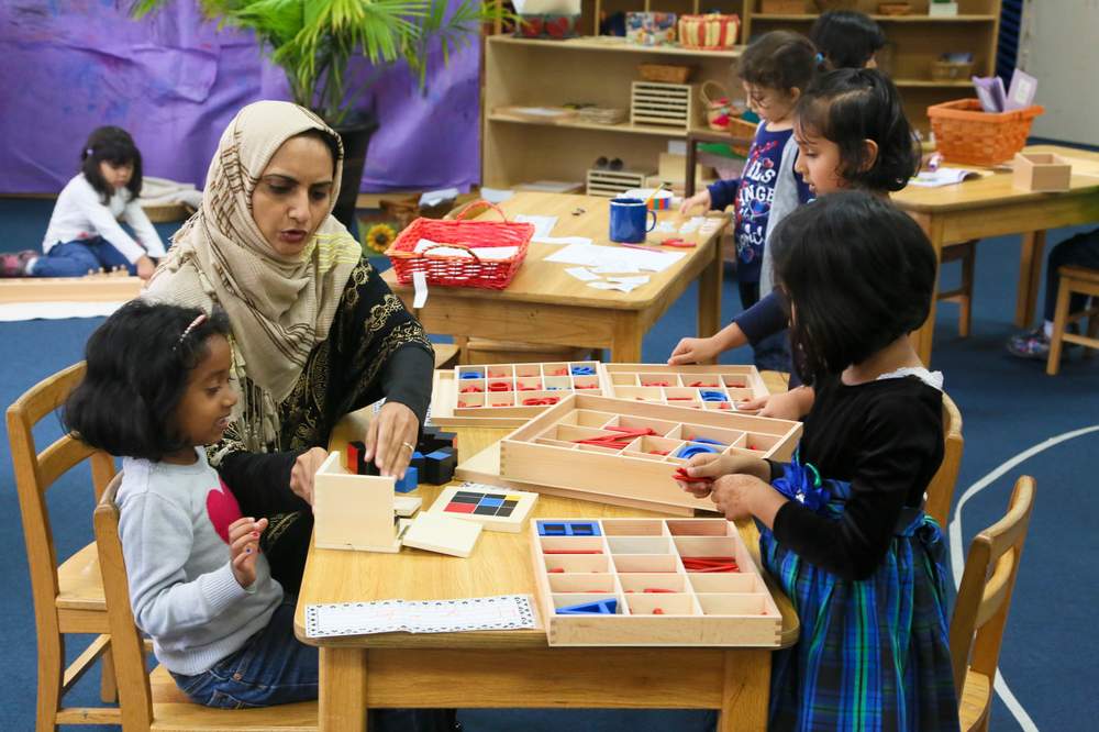 Assistant teacher Faiza Mohammed works with students at the El-Sewedy International Academy of Cincinnati, Wednesday, Nov. 4, 2015, on the campus of the Islamic Center of Greater Cincinnati.